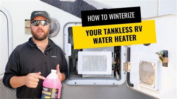 How do I turn on my hot water heater in my travel trailer?
