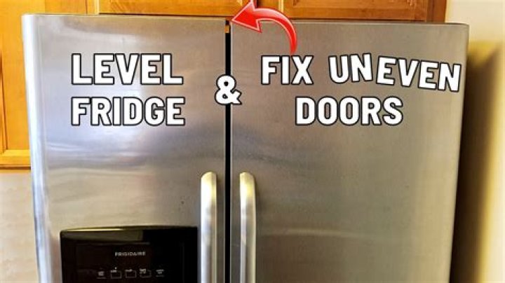 How do you adjust the top of a freezer door?