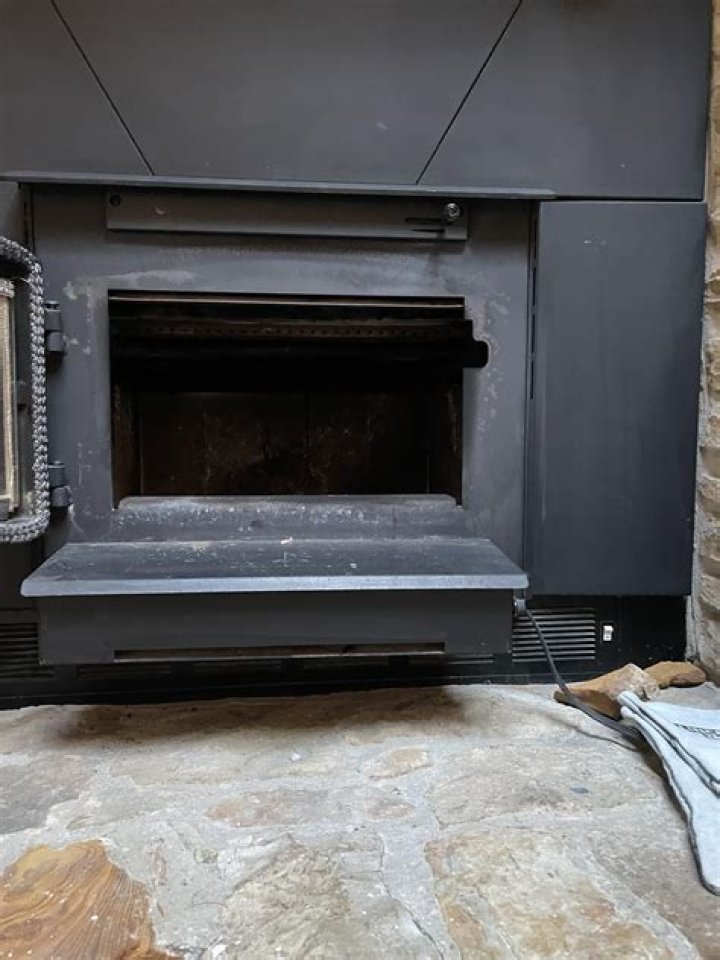 How do you control a damper on a wood stove