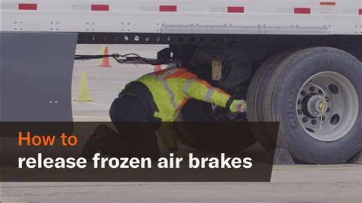 How do you release frozen tractor brakes?