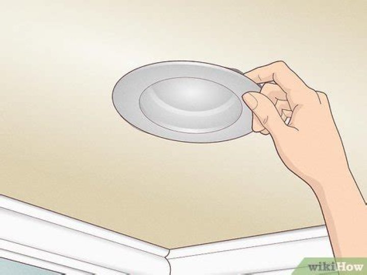 How do you remove old ceiling light covers?