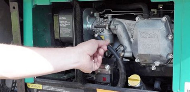 How to change spark plugs on Onan 5500 gas generator?