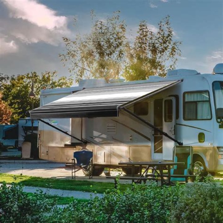 What causes an electric awning to retract?