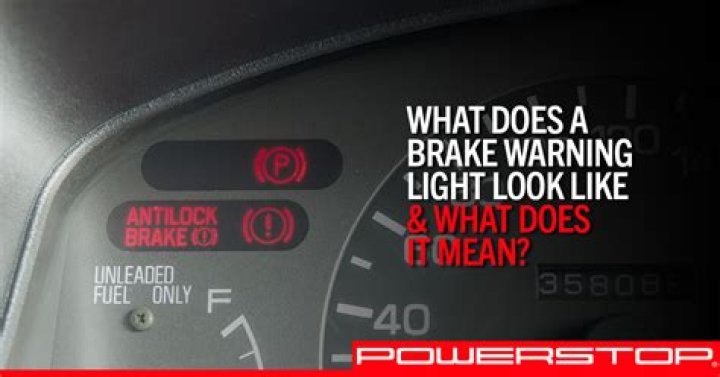 When does the brake fluid warning light come on?