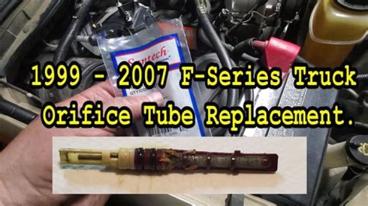 Where is the orifice tube on a 1999 Suburban?