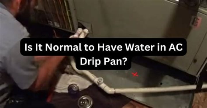 Why does AC drip pan fill with water?